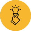 A hand holding a light bulb on a yellow background.