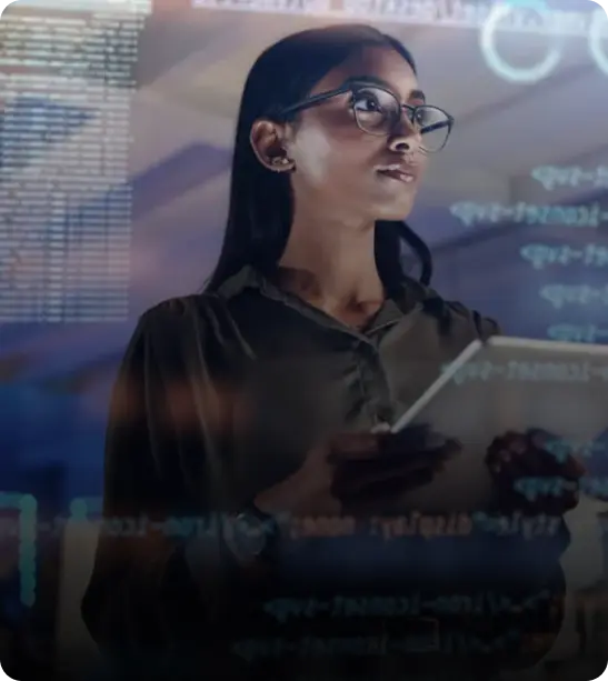 A woman with long hair and glasses stands in front of digital code, holding a tablet and gazing thoughtfully.