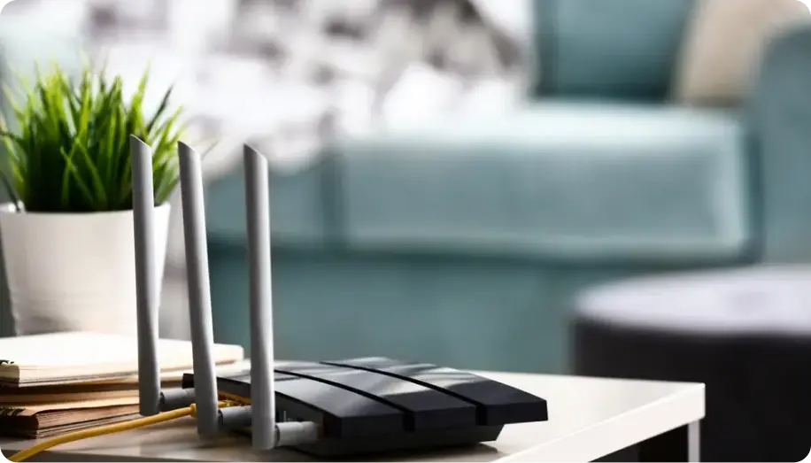 A router with multiple antennas on a table