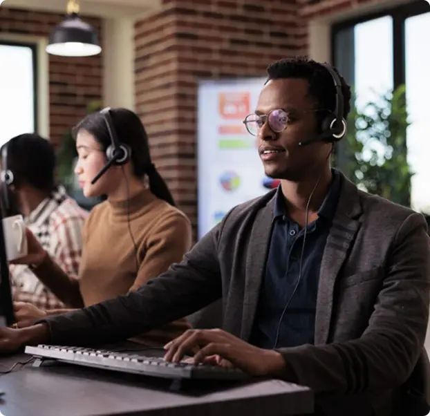 A group of people working at computers