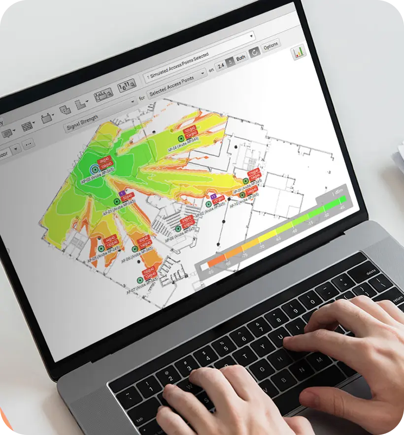 A laptop displaying a digital map with color-coded regions